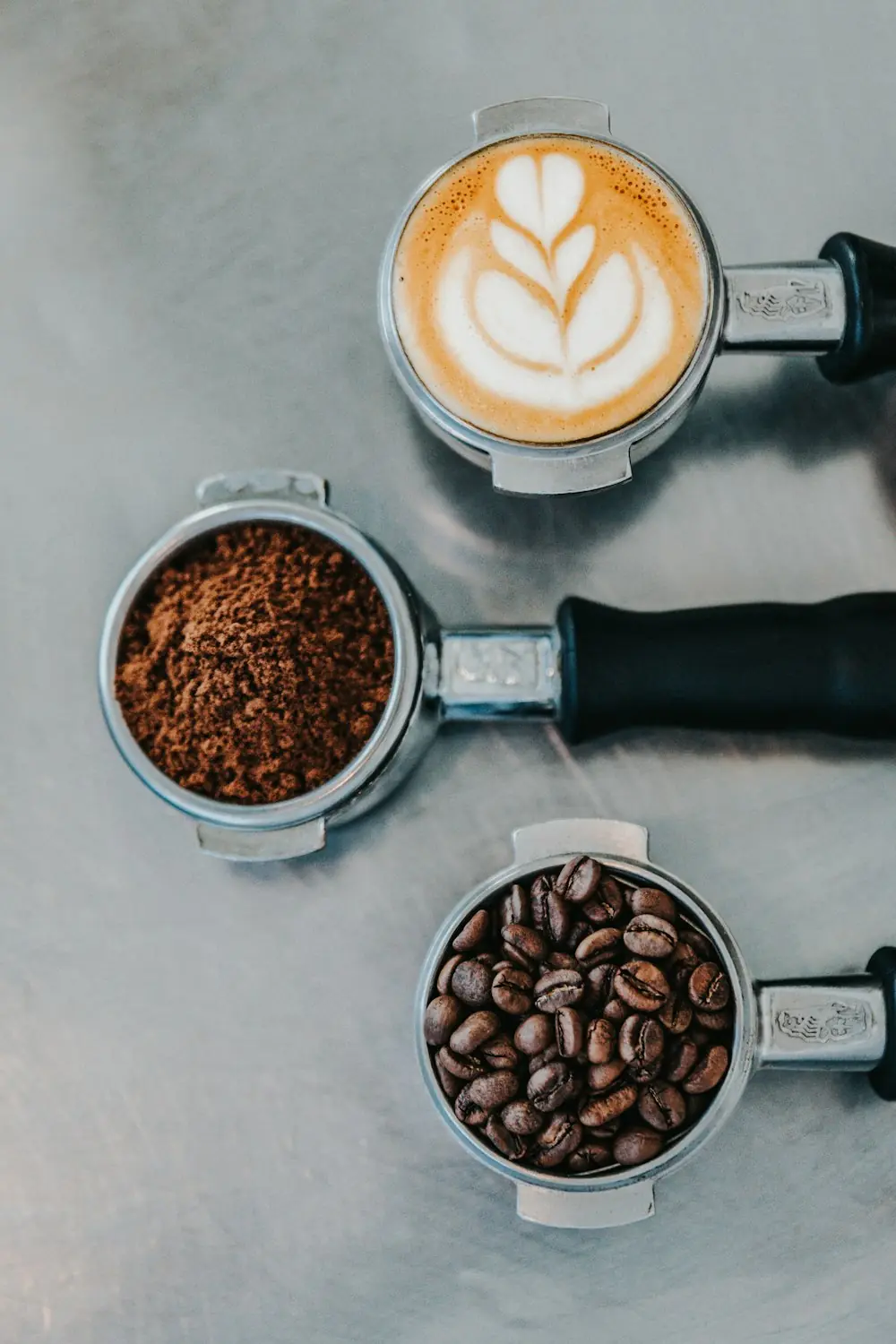 A barista pulling espresso from a portafilter
